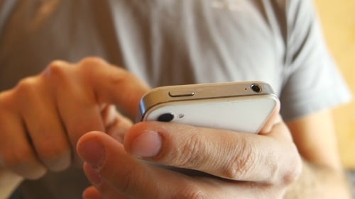 Young Man Using Mobile Phone - Smartphone
