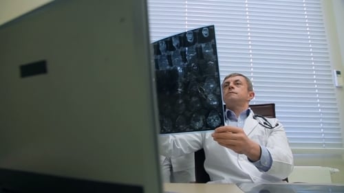 Doctors Examining An X-ray