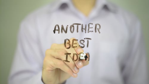 Man Writes Another Best Idea on Clear Surface