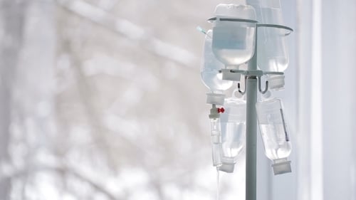 Intravenous Fluid Bags Drip in Bright Hospital Setting