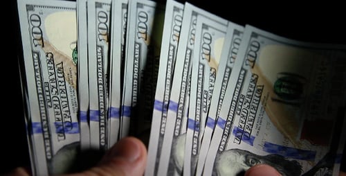 Hands Count Stack of One Hundred Dollar Bills