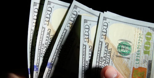 Counting Hundred Dollar Bills at Night