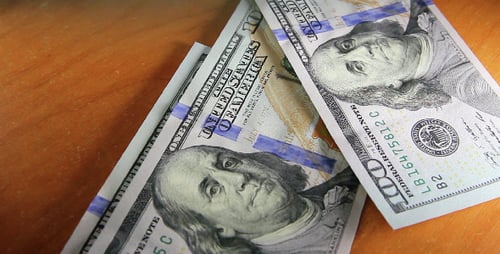 Pile of US One Hundred Dollar Bills