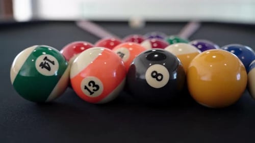 Closeup of a Billiard Table with Balls and Cue for Gambling Indoors