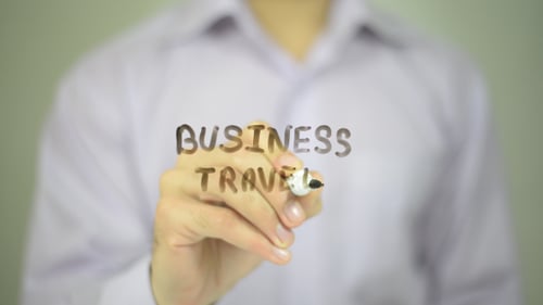 Writing Business Travel with Marker Close Up