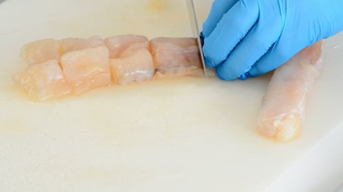 Fish Cut into Cubes on Cutting Board