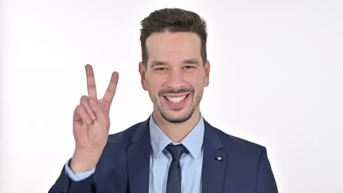 Smiling Man Showing Peace Sign on White Background
