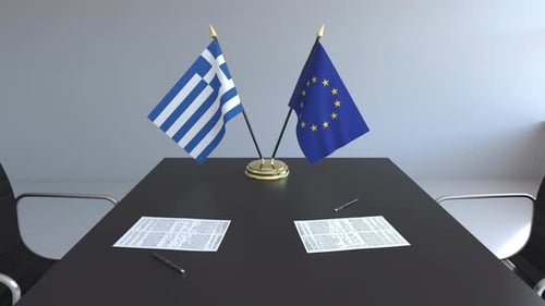Greek and EU Flags on Meeting Table for Diplomatic Relations