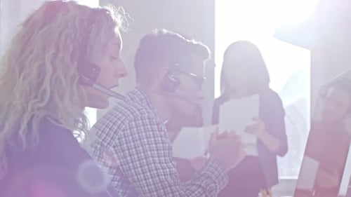 Female Helpdesk Operator Working in Office