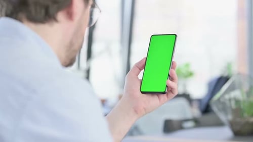 Adult Using Smartphone with Chroma Key Area