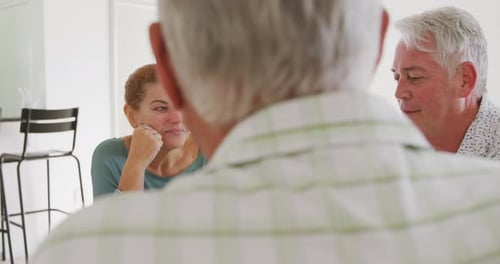 Friends Enjoying Coffee and Conversation at Home