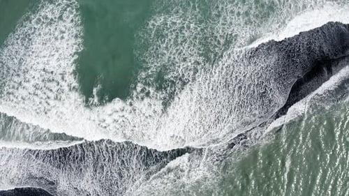 White Foam Waves At Reynisfjara Beach During Daytime - aerial top down