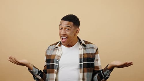 Cheerful Man Jumping and Dancing in Studio