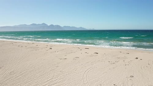 Waves Crashing on White Sand Beach and the Seascape
