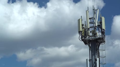 mobile communications tower against the sky. time lapse