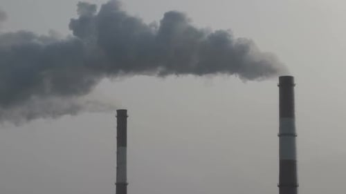 Industry Pipes Pollute the Atmosphere With Smoke