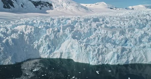 Closeup Ice Glacier Melting at Ocean Bay Antarctica Aerial