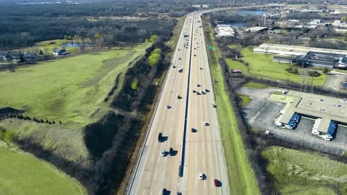 Flight Over the Highway and Car Traffic Moving in the Direction of the Big City