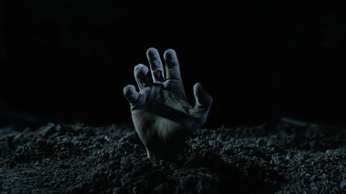 Creepy Hand Reaching Out From Dark Earth