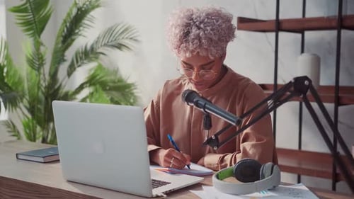 Smiling African Blogger Leads Popular Live Stream Video at Home Studio Podcast