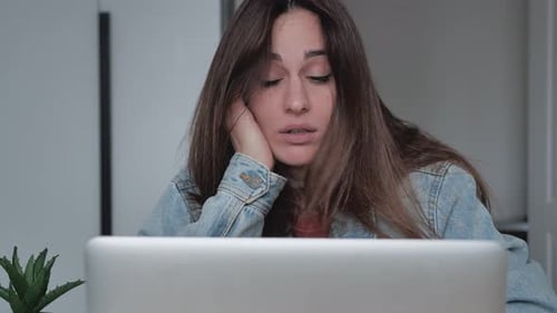 Close Up of Young Woman Almost Falling Asleep While Working Long Hours on Laptop