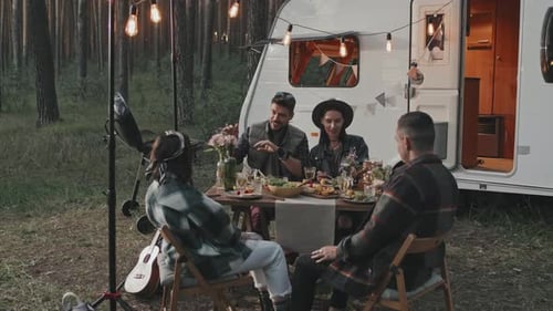 Friends Having Dinner at Campground