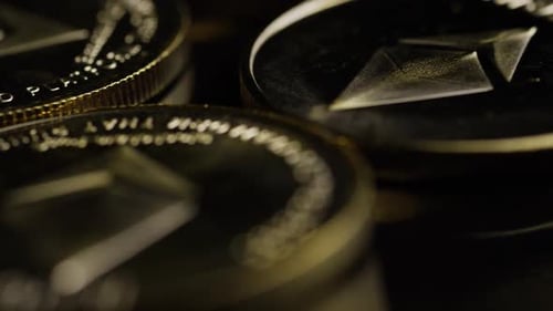 Rotating shot of Bitcoins (digital cryptocurrency) - BITCOIN ETHEREUM 128