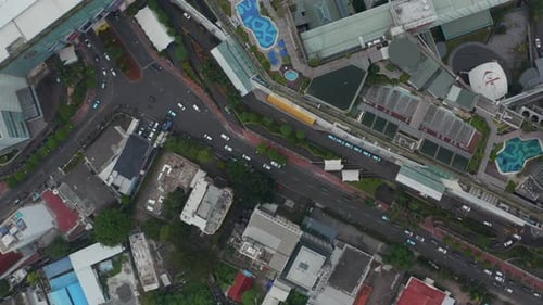 Aerial Birds Eye Overhead Top Down View Closing in on Dense Street Car Traffic in City Neighborhood