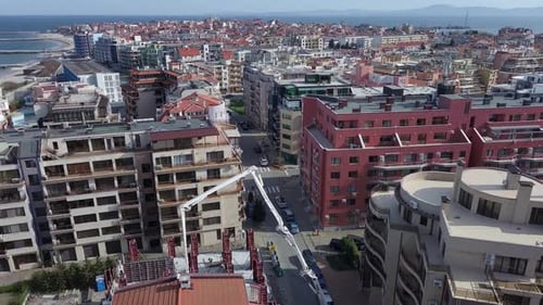 Aerial View of the Construction of Apartments in the Area with Streets and Cars Near the Black Sea