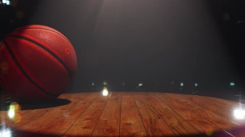 Rolling Basketball on Spotlighted Wooden Court