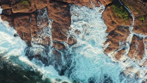 Bewitching Sight of Fascinating Patterns of Sea Foam From the Waves Breaking on the Rocks