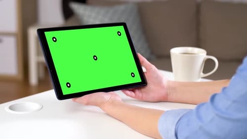 Hands Holding Tablet Pc with Green Screen at Home 108