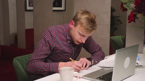 Young Adult Studies at Desk Inside