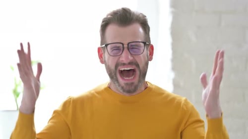 Man Reacting in Shock and Yelling