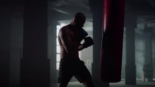 Man Doing Boxing Training in Fighting Club