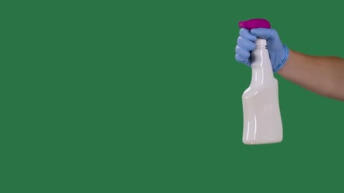 Hand in Glove Holds Cleaning Spray Bottle