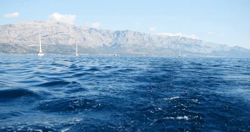 Sail Boats on Sea with Cloudy Sky