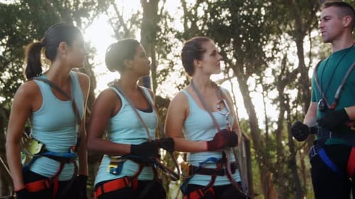 Women Preparing for a Treetop Adventure Course