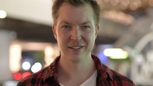 Young Handsome Hipster Man Smiling In The City At Night