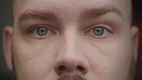 Close Up of a Caucasian Male Blue Eyes Hitting Up an Eyebrow