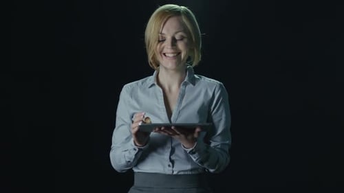 Joyous Woman Using Tablet