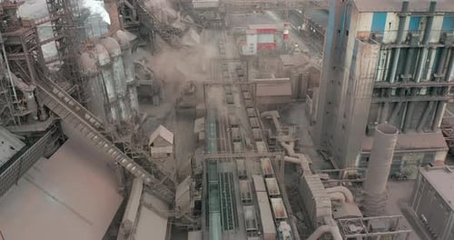 Epic Aerial of Pipes with White Smoke Emission. Plant Pipes Pollute Atmosphere. Industrial Factory