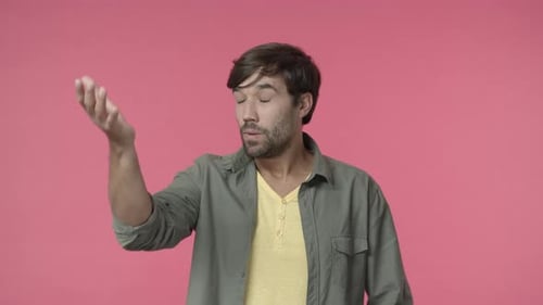 Man Touching Hair With an Exasperated Expression