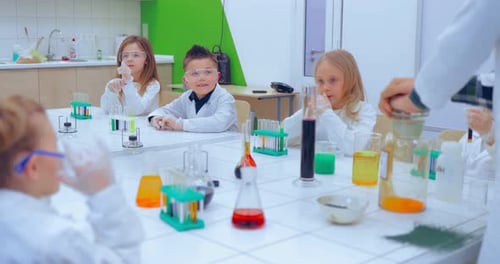 Children Conduct Science Experiment in Classroom