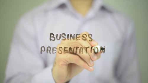 Adult Writes 'Business Presentation' With Marker