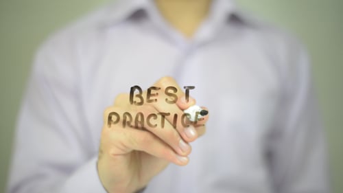 Hand Writing 'Best Practice' on Clear Surface