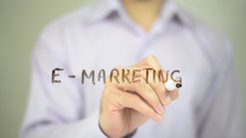 Hand Writing E-Marketing on Glass