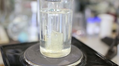 Clear Liquid Mixed in a Laboratory Beaker
