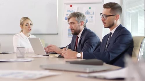 Business Meeting with Colleagues in a Conference Room