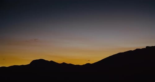 Panorama Overview of Mountain Silhouette on Sunset Landscape